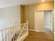Open stairway leads to upper level, showcasing wood-style floors and bright, neutral walls at 9821 Sedona Shrine Ave, Las Vegas, NV 89148