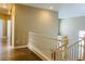 Bright stairway with wooden handrail, provides access to the home's upper level at 9821 Sedona Shrine Ave, Las Vegas, NV 89148