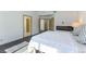Well-lit bedroom with hardwood floors, ample closet space and a fireplace at 9937 Whalers Landing Ct, Las Vegas, NV 89117