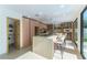 Modern kitchen boasts a large island with seating and stainless steel appliances at 9937 Whalers Landing Ct, Las Vegas, NV 89117