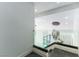 Modern staircase featuring glass railings and sleek design at 9937 Whalers Landing Ct, Las Vegas, NV 89117