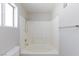 This bathroom features a soaking tub with a shower, neutral walls, and an open window at , Las Vegas, NV 89120