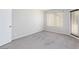 The bedroom has soft carpeting, a window, a door and neutral walls and is awaiting your personal touch at , Las Vegas, NV 89120