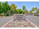 Welcoming stone sign marking the entrance to Canyon Willow, surrounded by mature trees at , Las Vegas, NV 89120