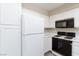 Well-lit kitchen featuring white appliances and ample cabinet space at , Las Vegas, NV 89120