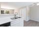 Open-concept kitchen featuring white cabinets and a breakfast bar at , Las Vegas, NV 89120
