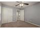 Bedroom with ceiling fan, closet, and carpet flooring at 104 Big Cliff Ave, North Las Vegas, NV 89031