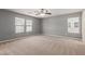 Spacious bedroom with carpet flooring, neutral walls and large windows for natural light at 104 Big Cliff Ave, North Las Vegas, NV 89031