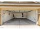 Spacious two car garage with a door and visible utilities at 104 Big Cliff Ave, North Las Vegas, NV 89031