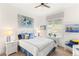 Cozy bedroom with white furniture, coordinated decor, and plenty of natural light at 10404 Long Leaf Pl, Las Vegas, NV 89134