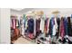 Walk-in closet with ample storage space and lots of shelving for clothes and accessories at 10404 Long Leaf Pl, Las Vegas, NV 89134