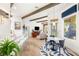 Open kitchen with bar seating flows into a living area with backyard access and views at 10404 Long Leaf Pl, Las Vegas, NV 89134