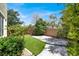 Landscaped backyard featuring artificial turf and brick pavers at 10845 Drake Ridge Ave, Las Vegas, NV 89166