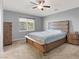 Cozy bedroom with neutral tones, wood furniture, and a window at 10845 Drake Ridge Ave, Las Vegas, NV 89166