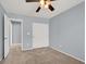 This bedroom features plush carpet and a closet at 10845 Drake Ridge Ave, Las Vegas, NV 89166