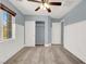 Neutral bedroom features a ceiling fan, and a large window at 10845 Drake Ridge Ave, Las Vegas, NV 89166