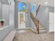 Inviting entryway with staircase, large window, and decorative front door at 10845 Drake Ridge Ave, Las Vegas, NV 89166