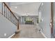 Spacious foyer with staircase and open view to the living room, creating a welcoming entrance at 10845 Drake Ridge Ave, Las Vegas, NV 89166