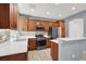 Modern kitchen with stainless steel appliances, wood cabinets, and stylish backsplash at 10845 Drake Ridge Ave, Las Vegas, NV 89166