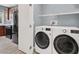 Convenient laundry room with modern washer and dryer, located near the kitchen at 10845 Drake Ridge Ave, Las Vegas, NV 89166