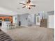 Expansive living space with a staircase, seamlessly connecting to the kitchen and front entryway at 10845 Drake Ridge Ave, Las Vegas, NV 89166