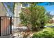 This side yard features artificial turf, stone, and lush plants at 10845 Drake Ridge Ave, Las Vegas, NV 89166