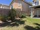 The backyard features a well-manicured lawn, roses, and mature landscaping at 11029 Meadow Leaf Ave, Las Vegas, NV 89144