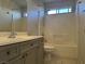 Traditional bathroom with vanity, toilet, and tub/shower combo with tile surround at 11029 Meadow Leaf Ave, Las Vegas, NV 89144