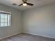 Bright bedroom with wood-look floors, a ceiling fan, and a window view at 11029 Meadow Leaf Ave, Las Vegas, NV 89144