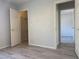 Bright, open bedroom showcasing sleek wood floors and closet at 11029 Meadow Leaf Ave, Las Vegas, NV 89144