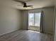 Bedroom with a ceiling fan, hardwood floors and natural light at 11029 Meadow Leaf Ave, Las Vegas, NV 89144