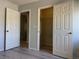 Bedroom featuring an open closet and doorway with white paneled doors at 11029 Meadow Leaf Ave, Las Vegas, NV 89144