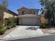 Charming two-story home with a red tile roof, a two-car garage, and a well-maintained front yard in a residential neighborhood at 11029 Meadow Leaf Ave, Las Vegas, NV 89144