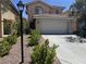 Charming two-story home featuring a well-manicured front yard and a two-car garage in a friendly neighborhood at 11029 Meadow Leaf Ave, Las Vegas, NV 89144