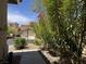 Attractive home exterior surrounded by lush, mature landscaping at 11029 Meadow Leaf Ave, Las Vegas, NV 89144