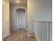 Hallway featuring neutral walls, white trim, and wood-look floors at 11029 Meadow Leaf Ave, Las Vegas, NV 89144
