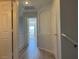 Upstairs hallway featuring neutral walls, white trim, and wood-look floors at 11029 Meadow Leaf Ave, Las Vegas, NV 89144