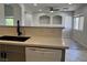 Open concept kitchen view into living room with bar countertop at 11029 Meadow Leaf Ave, Las Vegas, NV 89144