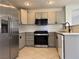 Kitchen with stainless steel appliances and white and gray cabinets at 11029 Meadow Leaf Ave, Las Vegas, NV 89144