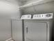 Laundry area with washer and dryer and wire shelving at 11029 Meadow Leaf Ave, Las Vegas, NV 89144