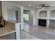 Open living room view from kitchen with fireplace and built-ins at 11029 Meadow Leaf Ave, Las Vegas, NV 89144