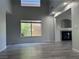 Spacious living room featuring a fireplace, large window, and laminate flooring at 11029 Meadow Leaf Ave, Las Vegas, NV 89144
