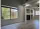 Bright living room boasting a fireplace and large window at 11029 Meadow Leaf Ave, Las Vegas, NV 89144