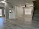 Spacious living room with wood-style flooring, staircase, recessed lighting, and arched entryways to other rooms at 11029 Meadow Leaf Ave, Las Vegas, NV 89144