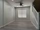 The light filled living room has a ceiling fan, a window, and stairs leading to the upper level at 11029 Meadow Leaf Ave, Las Vegas, NV 89144