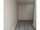 Small storage space with wood-style flooring and white walls at 11029 Meadow Leaf Ave, Las Vegas, NV 89144