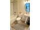 Well-lit bathroom features a walk-in shower, a modern pedestal sink, a toilet and a neutral color scheme at 11074 Caramel Crest Ct, Las Vegas, NV 89135