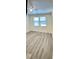 Spacious, sun-filled bedroom with wood-look flooring, offering a bright and airy space at 11074 Caramel Crest Ct, Las Vegas, NV 89135