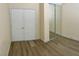 Spacious bedroom features wood-look flooring and a large closet with mirrored doors at 11074 Caramel Crest Ct, Las Vegas, NV 89135