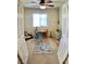 bedroom with a ceiling fan, desk area, and fun rug at 11074 Caramel Crest Ct, Las Vegas, NV 89135